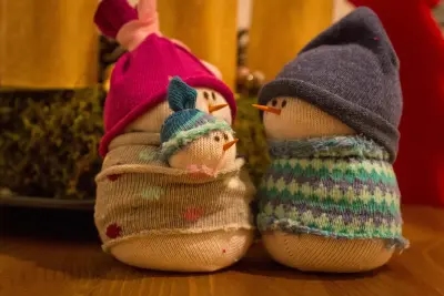 With some spare socks, rice, and a few household items, these no-sew snowmen are a charming addition to any home this Christmas!