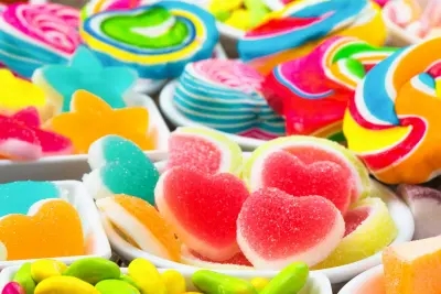 A candy buffet of pick n mix sweets in dishes