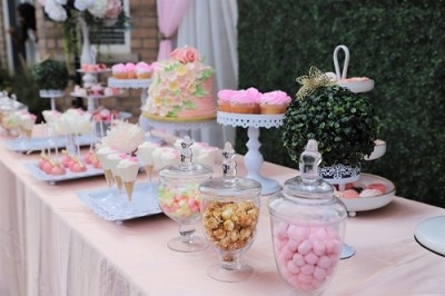 Candy bar with delicious pink sweets for birthday or wedding celebration
